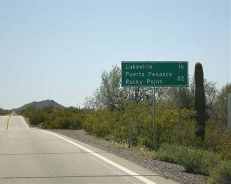 Road sign showing the distance to Lukeville, Puerto Peñasco and Rocky Point